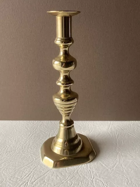 Antique possibly Victorian  brass candlestick with push rod. 9.5 inch tall .