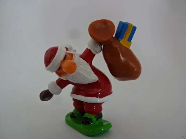 Statuetta natalizia ""Winachtsmann porta regali sullo snowboard - 40 mm