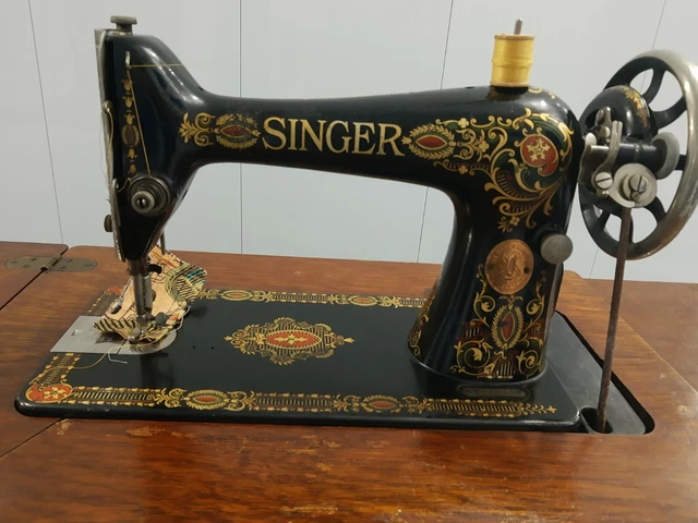 Antique 1917 Singer Treadle Red Eye Model 66 Sewing Machine on tiger oak cabinet