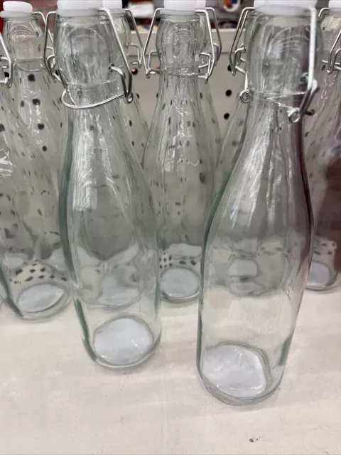 https://www.picclickimg.com/t-cAAOSwKOVlCFHx/Clear-Glass-Bottles-with-Flip-Top-Metal-Clasps.webp