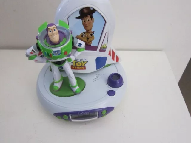 XIBOOK Disney Activity Toy Story Buzz & Woody Proiettore Radio Orologio Luce Notturna