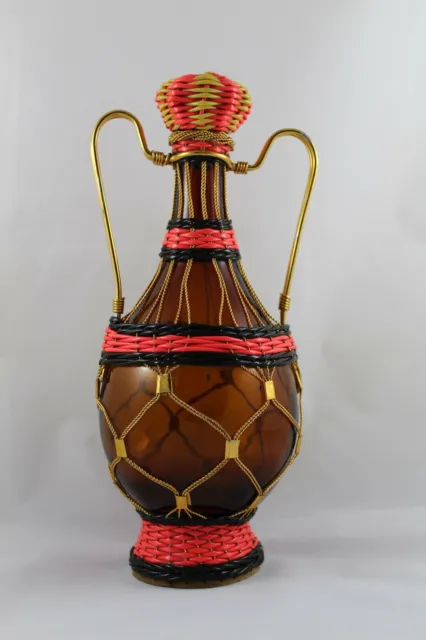 Old glass bottle lined and decorated by hand. Crafts. 31cm height.