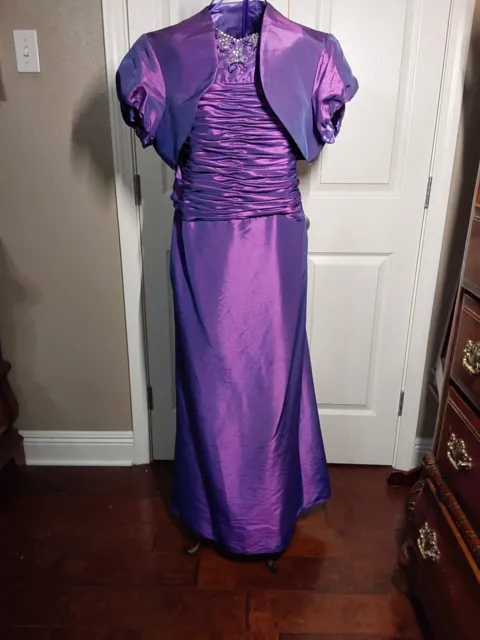 Gorgeous purple formal gown with rhinestones and corset style waist with lace up