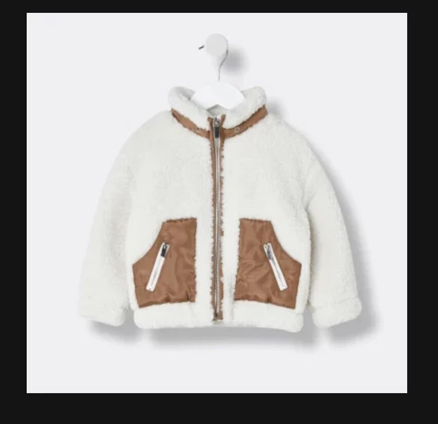 River island Mini girls cream zip funnel borg jacket. Aged 6-9 Months
