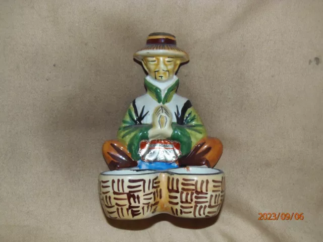 Vintage Exclusive Drioli Chinese man with baskets figurine bottle, 1960s.