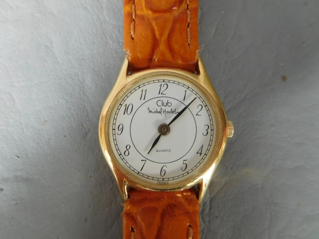 Michel Herbelin ancienne montre club ronde plaqué doré or bracelet cuir marron Michel Herbelin ancienne montre club ronde plaqué doré or bracelet cuir marron