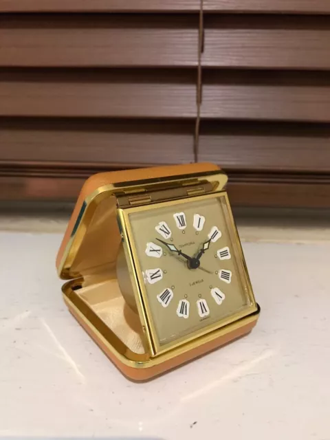 Vintage  Tempora travel alarm folding clock wind up 2jewels working nicely