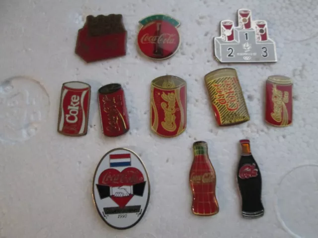 11  Pin's  différents   COCA-COLA