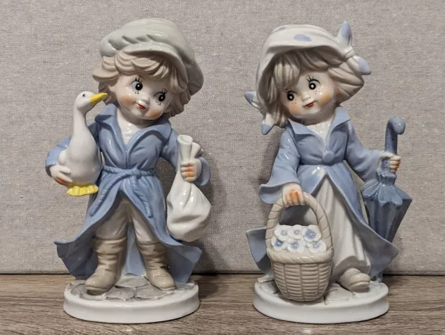 Pair Set Of 8" KPM Blue Porcelain Figurine Boy Girl White Goose Umbrella Germany