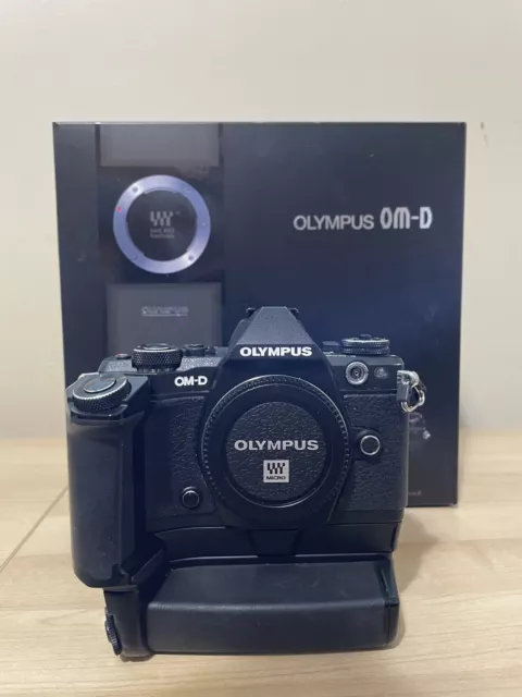 Olympus OM-D E-M5 Mark II (body), together with HLD-8G + HLD-6P bat holder/grip