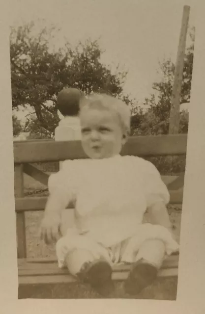 c1910 Photo Child Sitting Outside On Bench Wearing White Frock & Outfit RPPC