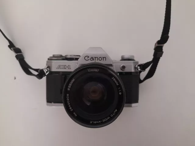 Cámara SLR Canon AE-1 black 35mm + lens Vivitar 55 mm 1:1.9 + battery new
