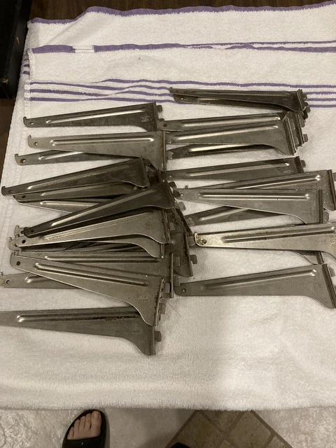8" Wall Shelf Brackets Silver.  Brand MD steel heavier brackets. 1" slot spacing