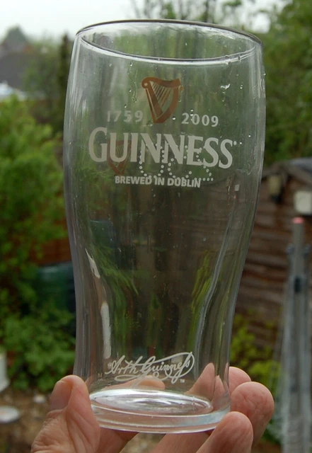 250 years Guinness Glass + bag of miniature plastic glasses of Guinness
