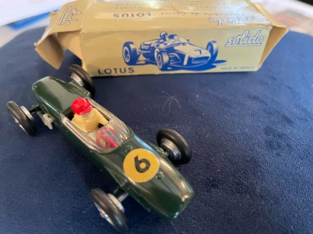 Solido 1/43 - Dark Green Lotus No. 6 - Driver's Helmet and Red Steering Wheel Version