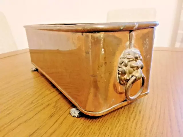 Vintage copper and brass lions head footed planter