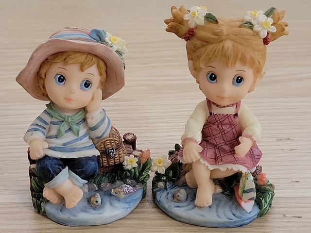 Montefiori RARE figurine Boy and Girl seating by the pond set of 2