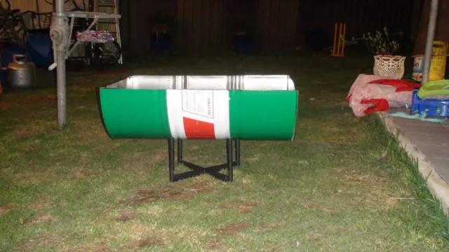 Fire drum 200 litre drum cut in half on a stand.