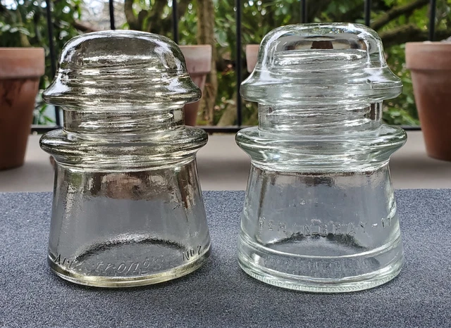 TWO CD 122 GLASS INSULATORS. OFF CLEAR Armstrong's No 2 and HEMINGRAY-17