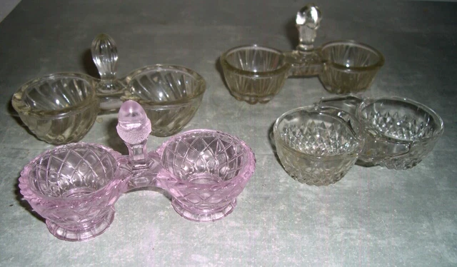 lot de quatre salerons . trois blancs un rose . en verre moulé pressé. bon état