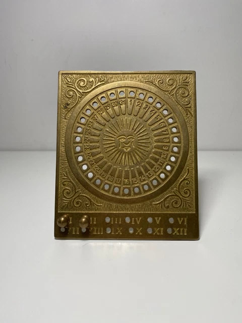 Miroir ovale soleil en laiton doré vintage 1960