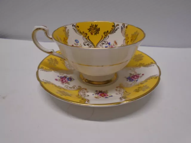 Paragon Teacup and Saucer #554A Yellow Floral and Gold 5.5" saucer 2.5" cup