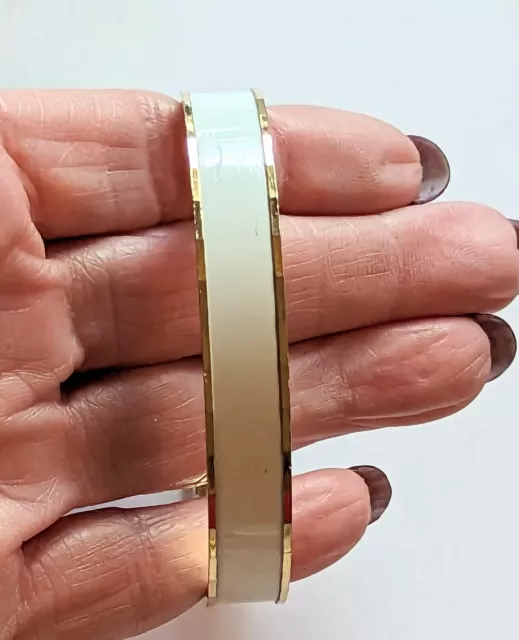 unique yellow gold tone and white enamel signed Monet bangle bracelet