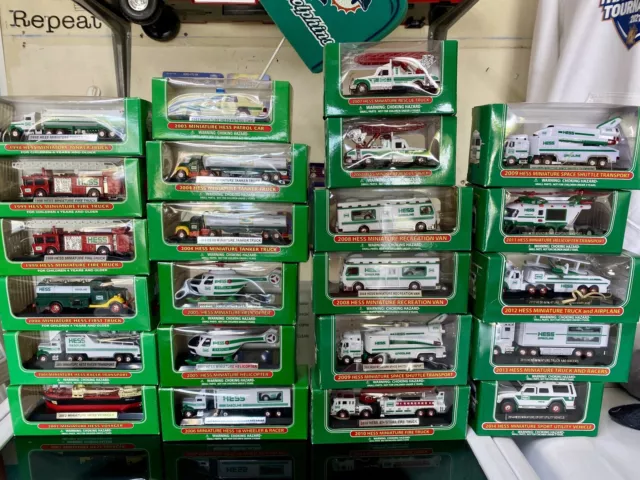 Lot of 26 Miniature Hess Trucks 1998-2014 Unopened Boxes Mini Hess Vehicles