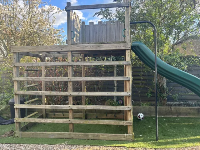 wooden climbing frame with slide