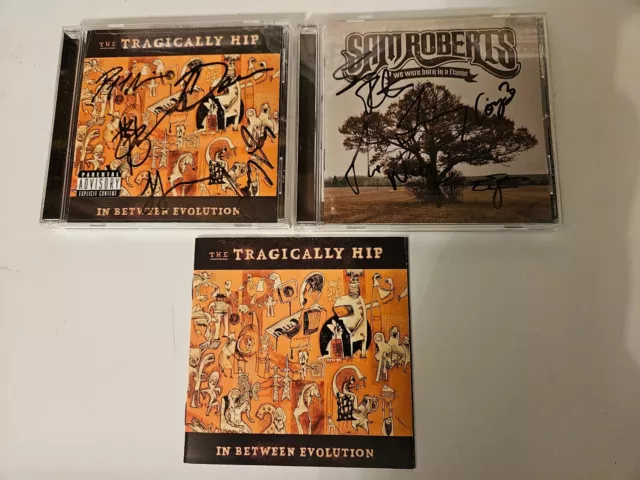 Tragically Hip + Sam Roberts signed CDs.  Plus bonus screensaver +ticket stubs