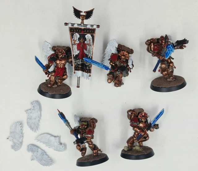 A red armored Warhammer 40k Blood Angel space marine making hand