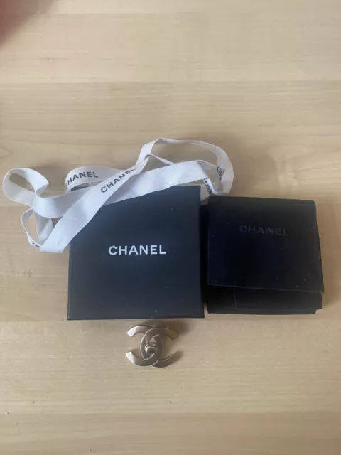 Chanel turnlock gold brooch cc
