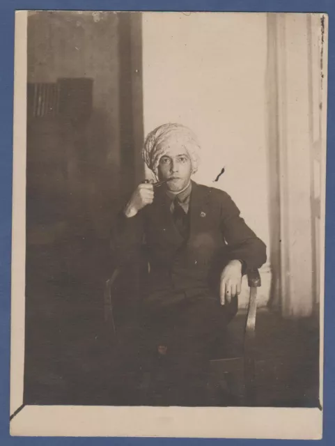 Handsome Guy smoking a pipe with a towel wrapped around his head Vintage Photo