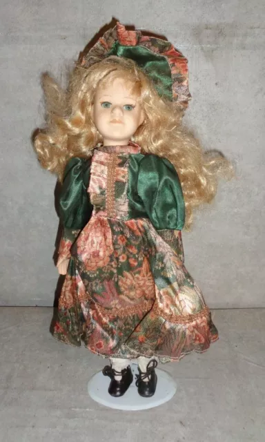 Vintage 16 In. Tall Blond Wavy Hair Porcelain Doll Green Eyes Green Dress