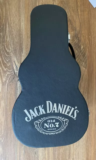 black case in the shape of a guitar, for a bottle of Jack Daniels whiskey