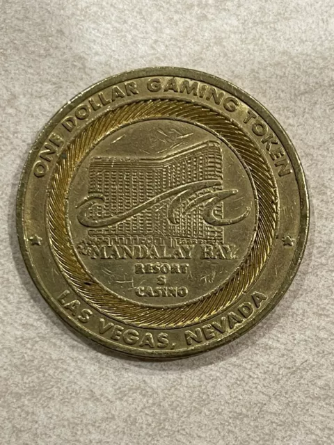 Vintage One Dollar Gaming Token Coin Mandalay Bay Resort Las Vegas NV