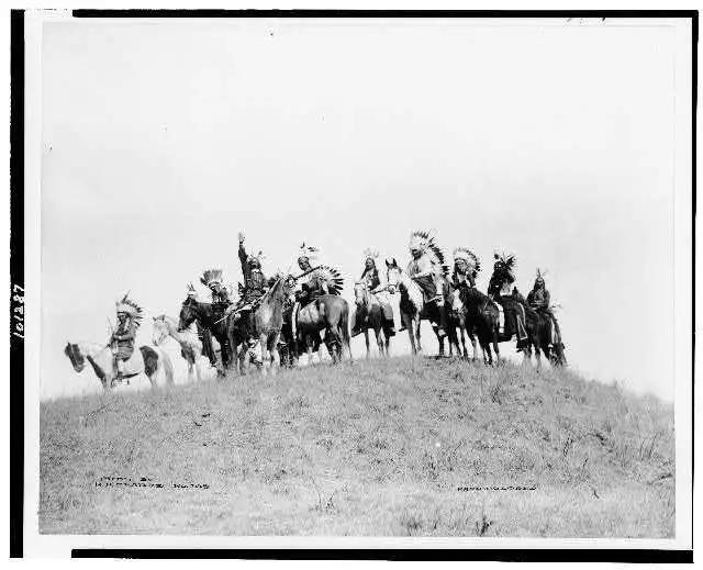 Ponca Indian scouts,horseback,headdress,feathers,hill,Bliss,Oklahoma,OK,1930