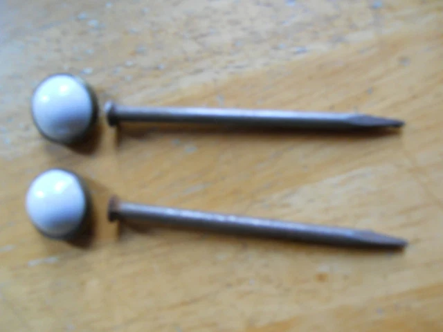 2 old Picture Nails artwork hangers white porcelain vintage 2 5/8 x 3/4” antique