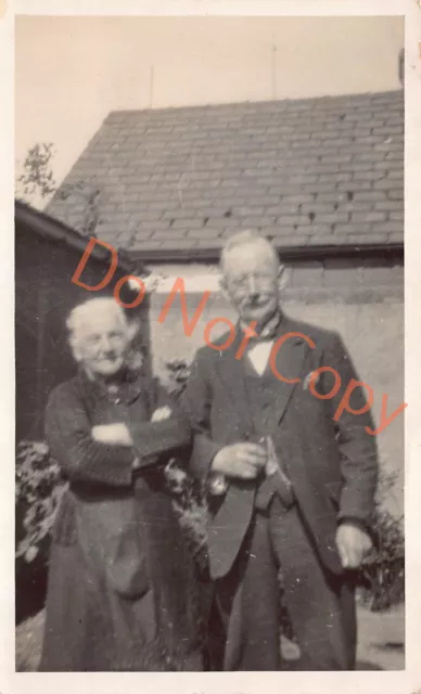 Older Couple in Garden W.C. Lawrie Workington Postcard (D871)