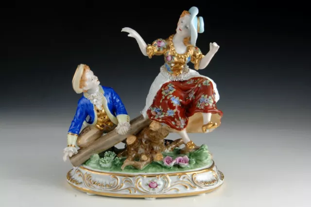 Enameled porcelain figurine. "Young couple on a seesaw." After model from Sèvres