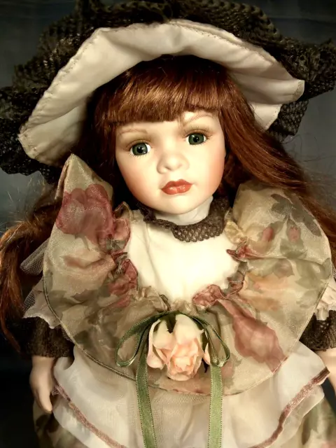 Porcelain Doll (717  )  17 "-43cm.  " Leonardo  Collection "Sitting doll