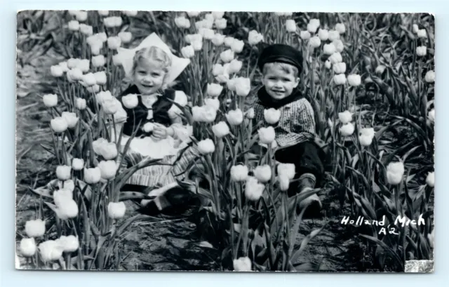 Postcard MI Holland Little Dutch Children in Tulip Field Real Photo RPPC H15
