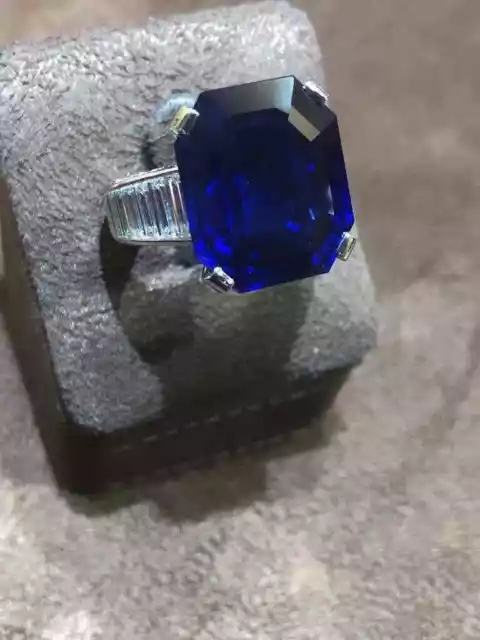 Royal Blue Emerald Cut 20.10CT Sapphire With Baguette & Round Cut CZ Fine Ring