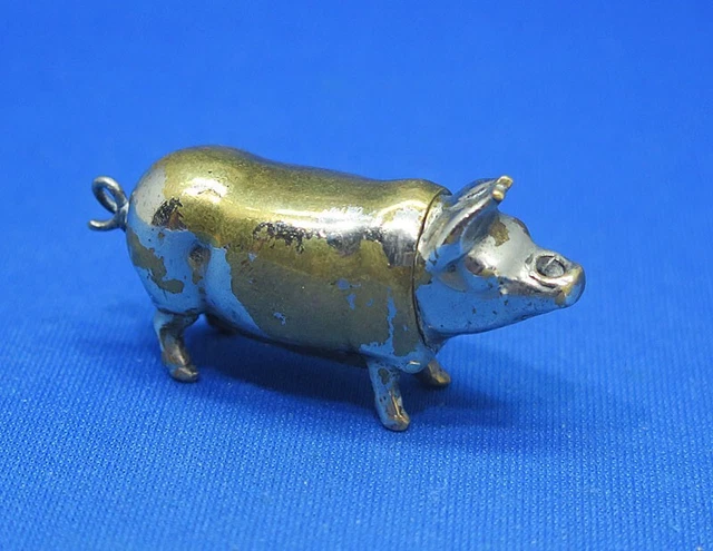 Match safe, figural standing pig, go-to-bed vesta socket, plated brass, c. 1895 Match safe, figural standing pig, go-to-bed vesta socket, plated brass, c. 1895