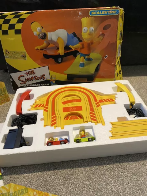 The Simpsons Skateboard Chase Homer and Bart Scalextric Micro Slot Racing Set.