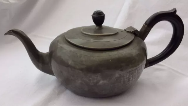 Antique pewter teapot.