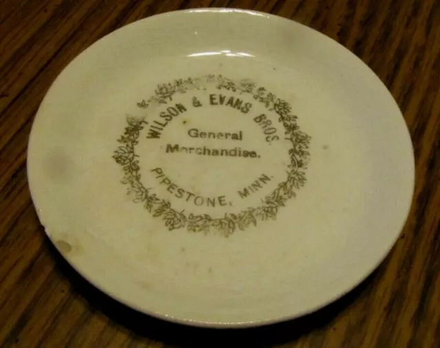 Antique Souvenir Advertising Butter Pat Plate Wilson & Evans Pipestone Minnesota