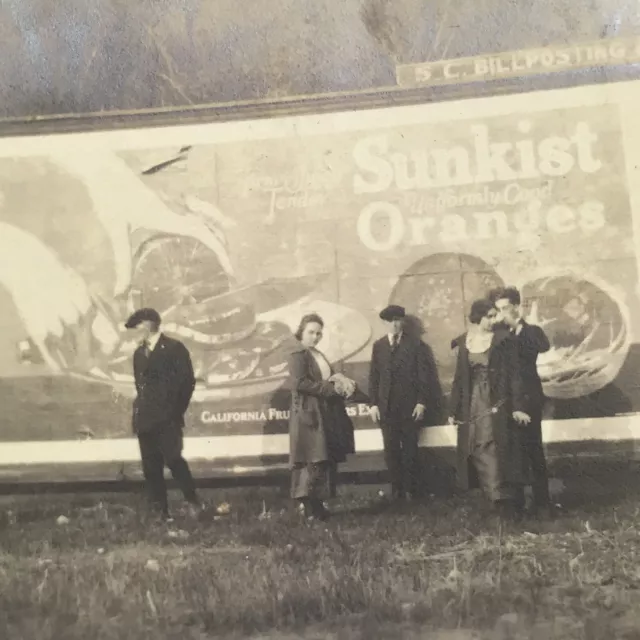 Vintage Sepia Photo Men Women Standing In Front Sunkist Oranges Billboard Sign