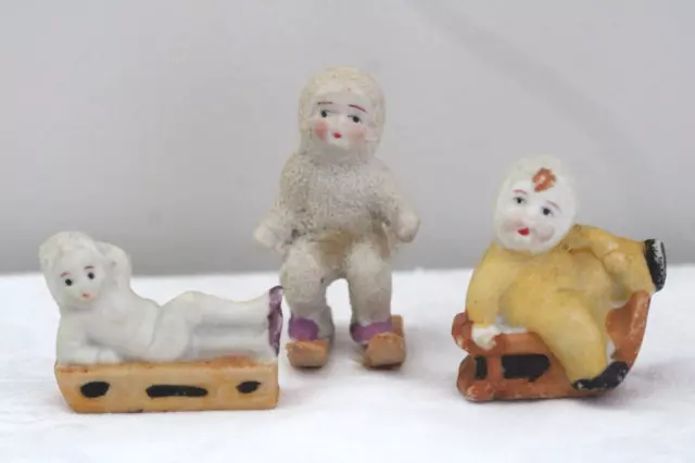 3 Vintage Porcelain Bisque Snow Babies on Sleds & Skiing