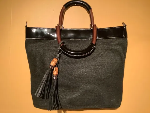Talbots black “shoulder, tote or handbag with tassels”.